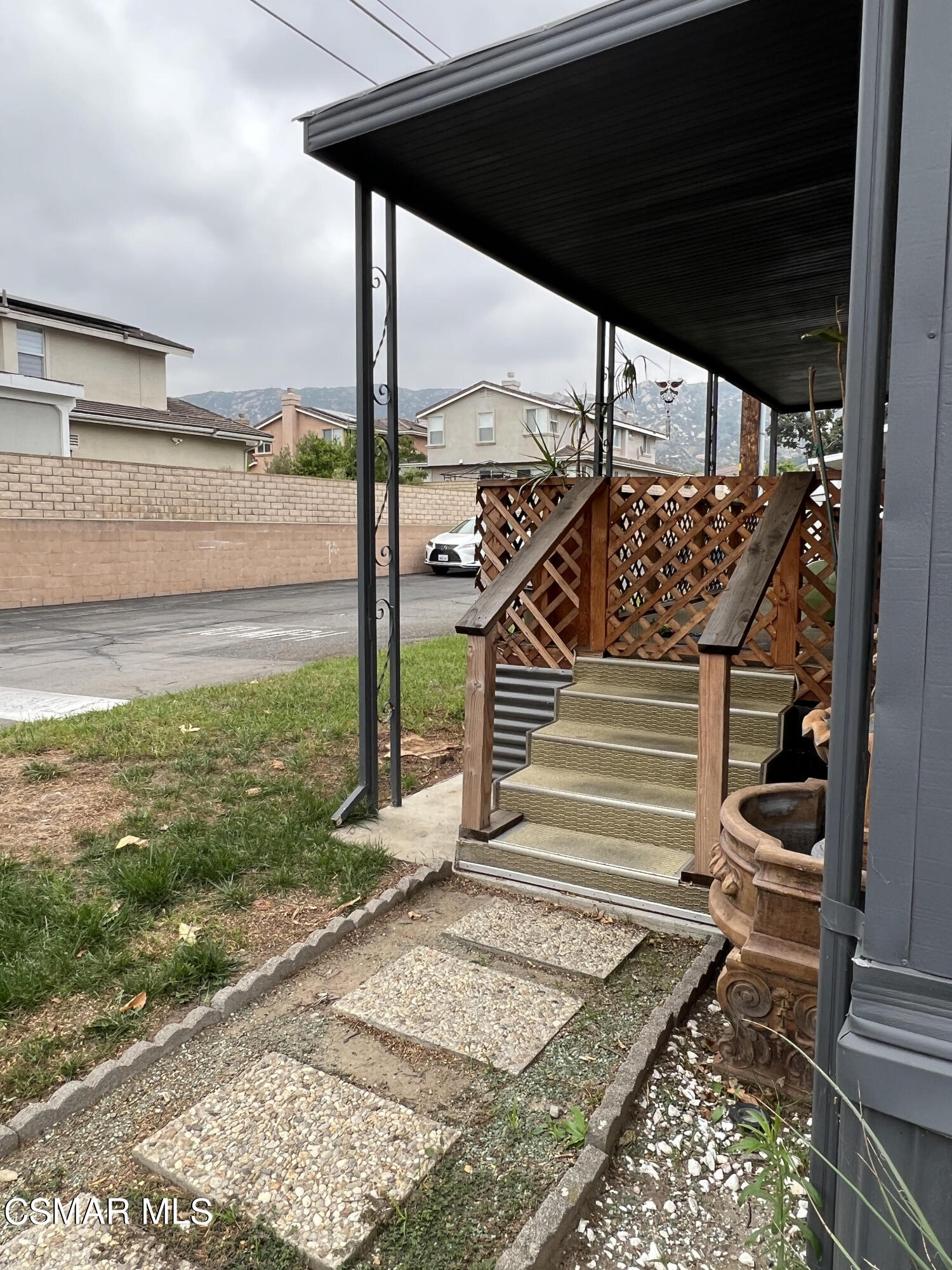 1550 Rory Lane, Unit 83 Simi Valley, CA 93063 - Photo 7 of 50 a view of a back yard from a patio