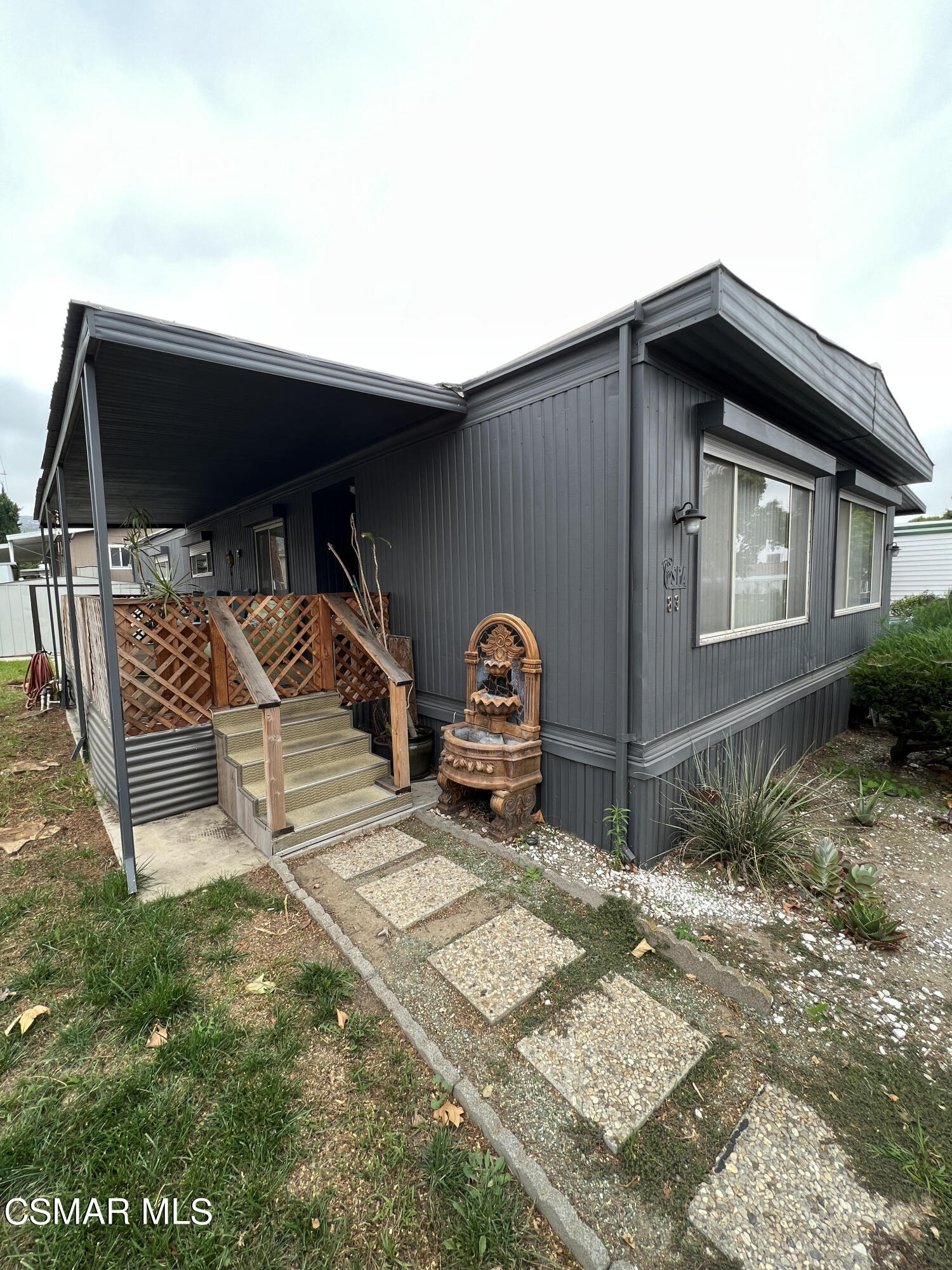 1550 Rory Lane, Unit 83 Simi Valley, CA 93063 - Photo 8 of 50 a car parked in front of a house