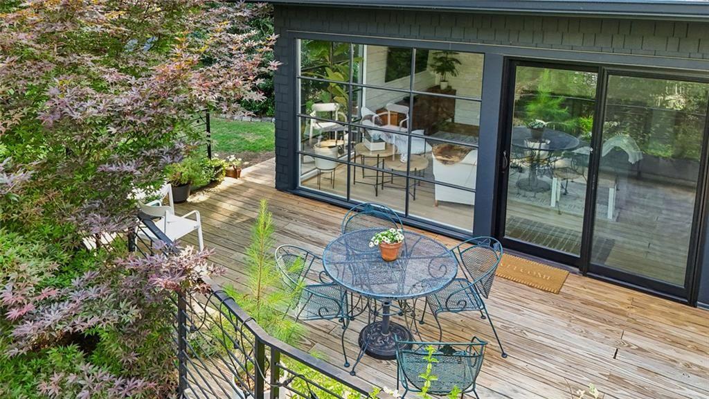 2069 Edinburgh Terrace Northeast Atlanta, GA 30307 - Photo 47 of 72 a view of a chairs and table in patio next to a yard