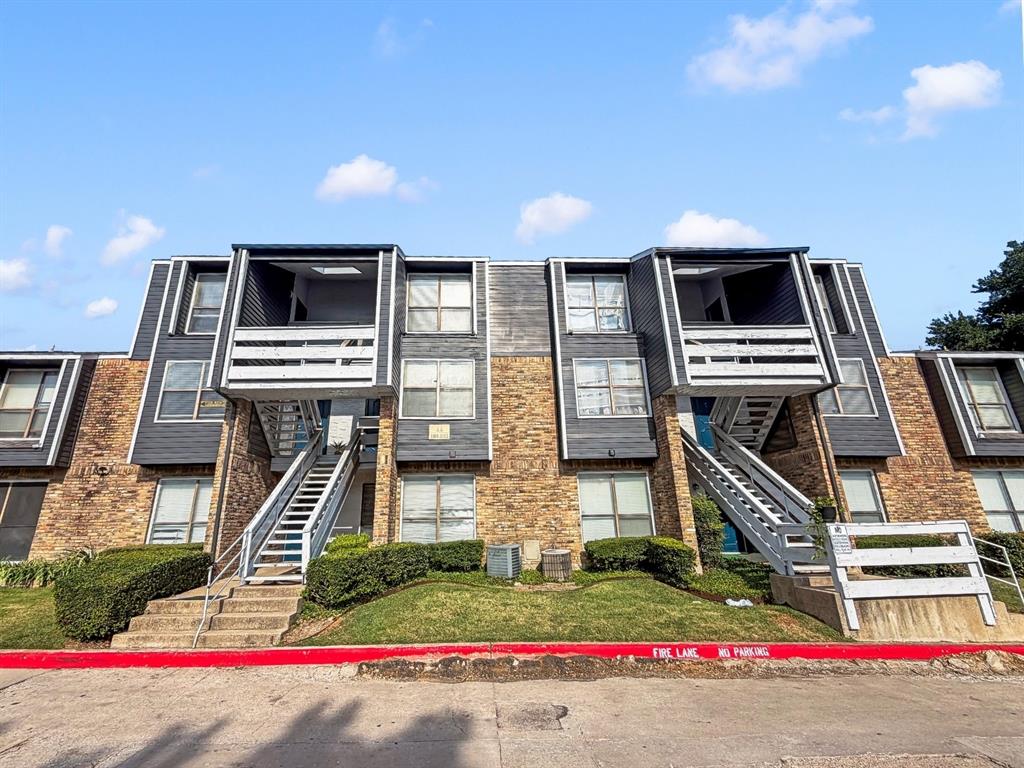 5840 Spring Valley Road, Unit 1104 Dallas, TX 75254 - Photo 1 of 16 Multi-story building featuring brick and dark siding accents