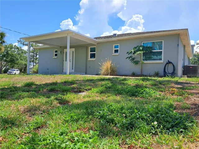 a view of a back yard of the house