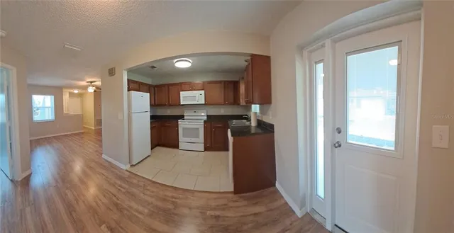 a view of a kitchen from the hallway