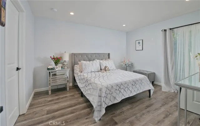 a bed room with a bed and a window