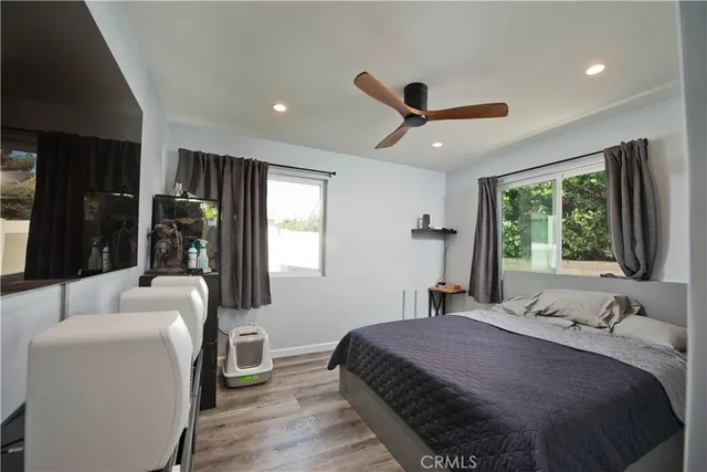 a bedroom with a large bed and a window