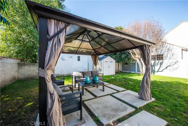 a view of yard with patio