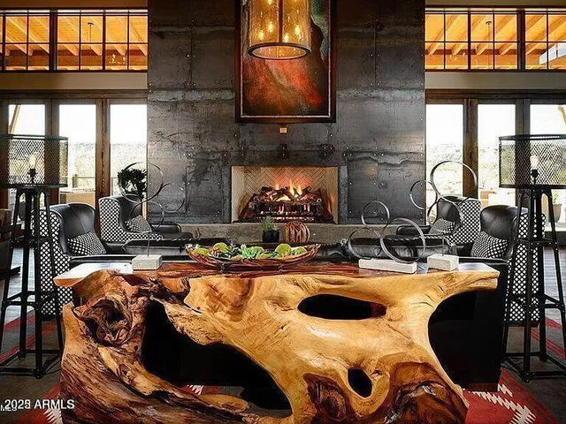 a view of a house with a yard and a lake view