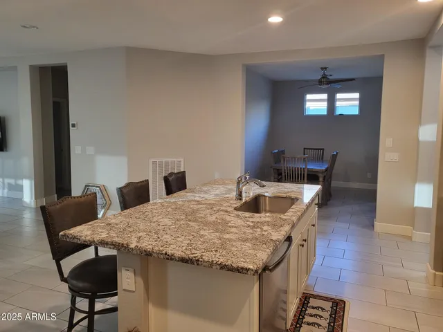 a kitchen with a table chairs and entryway