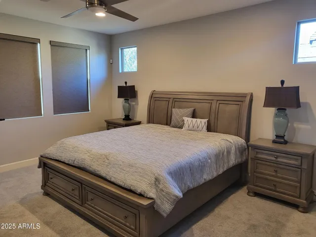 a bedroom with a bed and a dresser