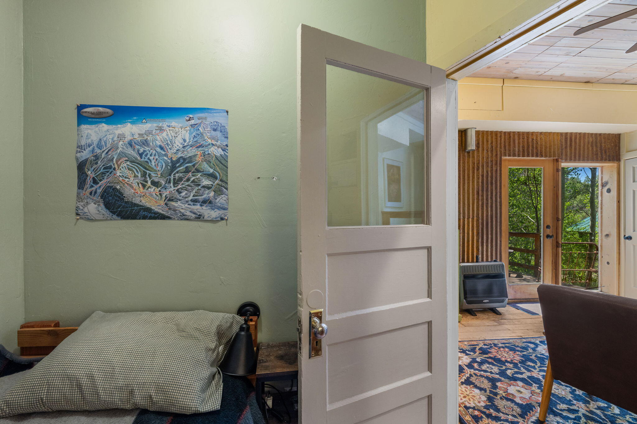 313 North Piedmont Street Rico, CO 81332 - Photo 18 of 43 a bedroom with a bed and a painting on the wall