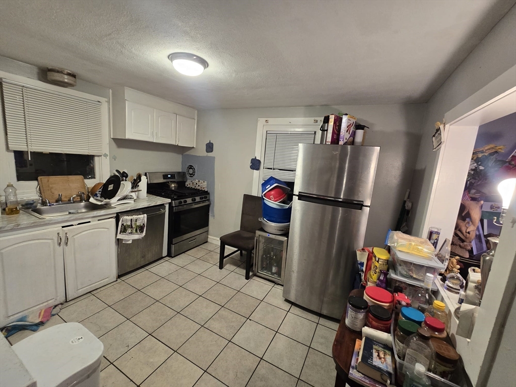 42 Raldne Road, Unit 1 Boston, MA 02136 - Photo 11 of 37 a kitchen with a refrigerator and a sink