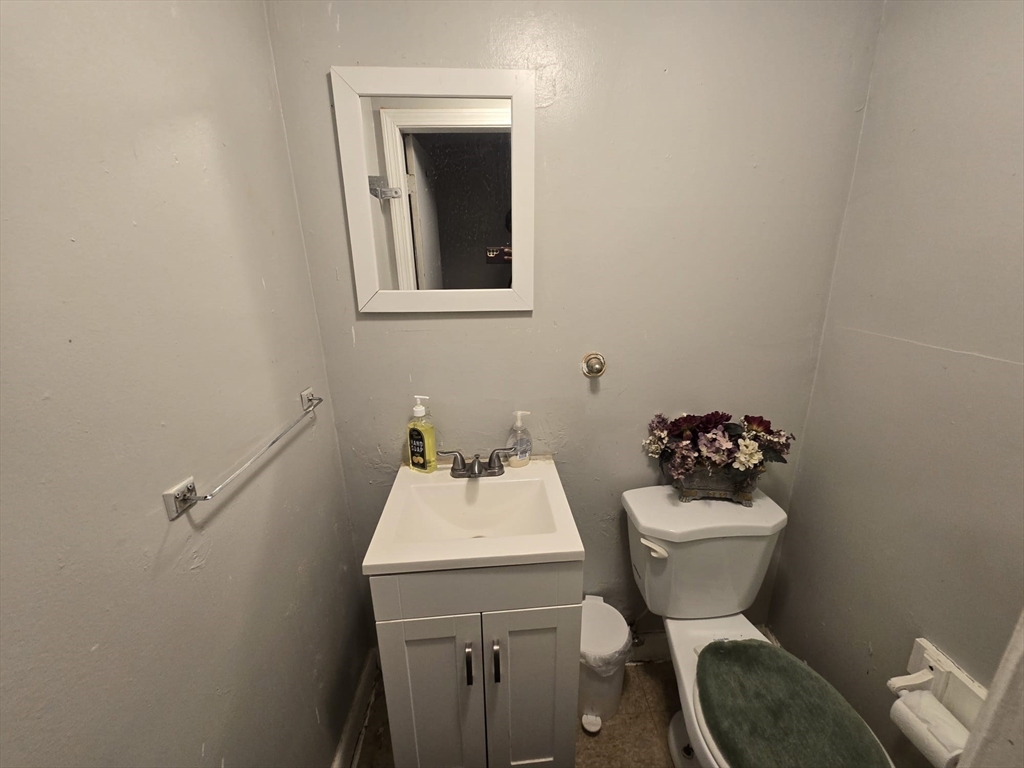 42 Raldne Road, Unit 1 Boston, MA 02136 - Photo 14 of 37 a bathroom with a toilet sink and mirror
