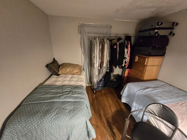 a bed room with a bed and a walk in closet