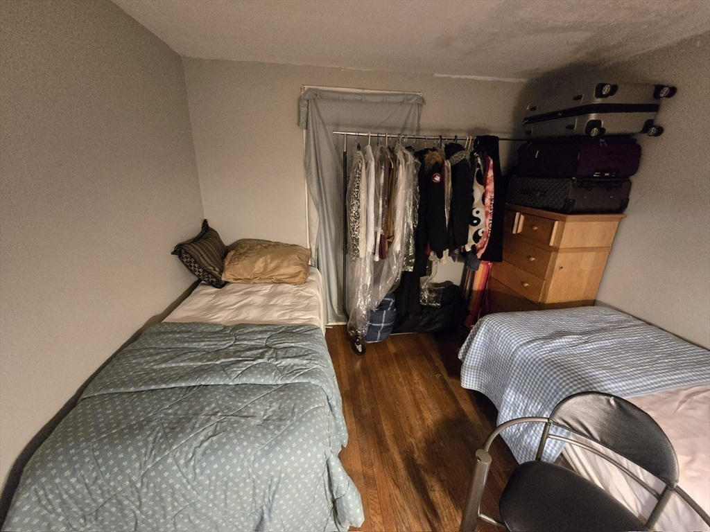 42 Raldne Road, Unit 1 Boston, MA 02136 - Photo 21 of 37 a bed room with a bed and a walk in closet