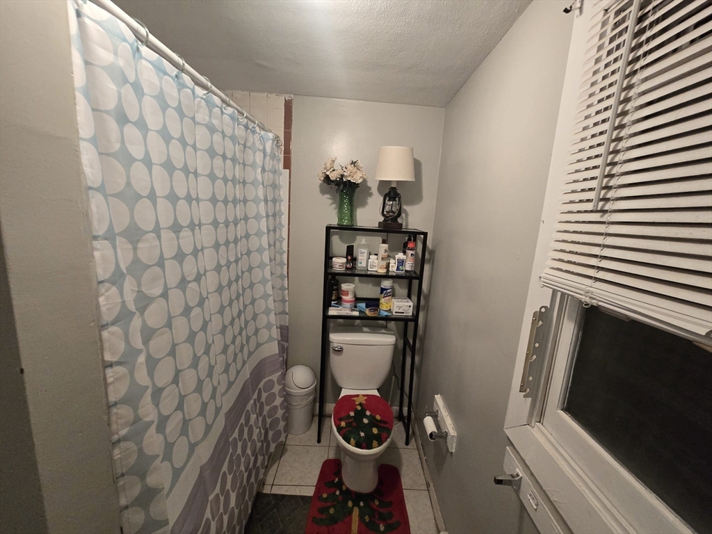 42 Raldne Road, Unit 1 Boston, MA 02136 - Photo 23 of 37 a bathroom with a sink and a mirror