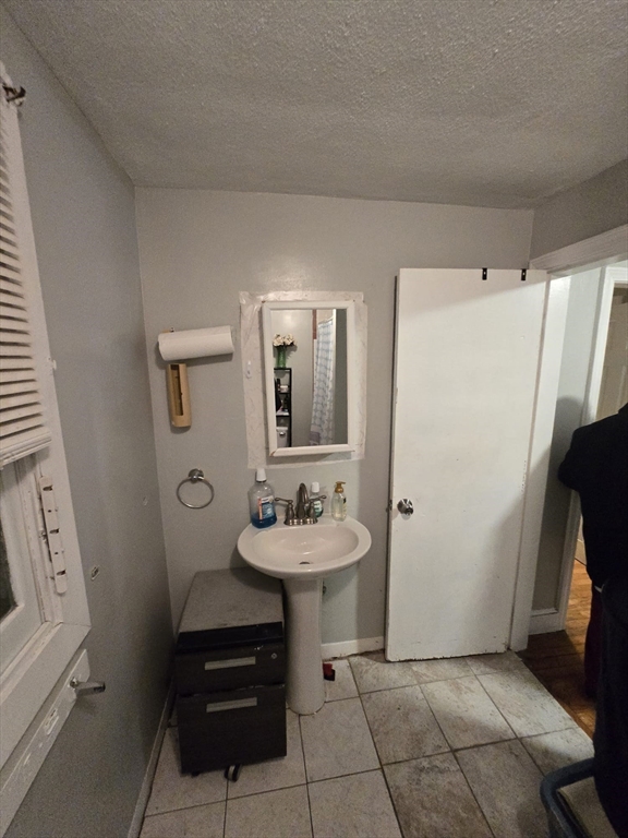 42 Raldne Road, Unit 1 Boston, MA 02136 - Photo 24 of 37 a bathroom with a sink a toilet and a mirror