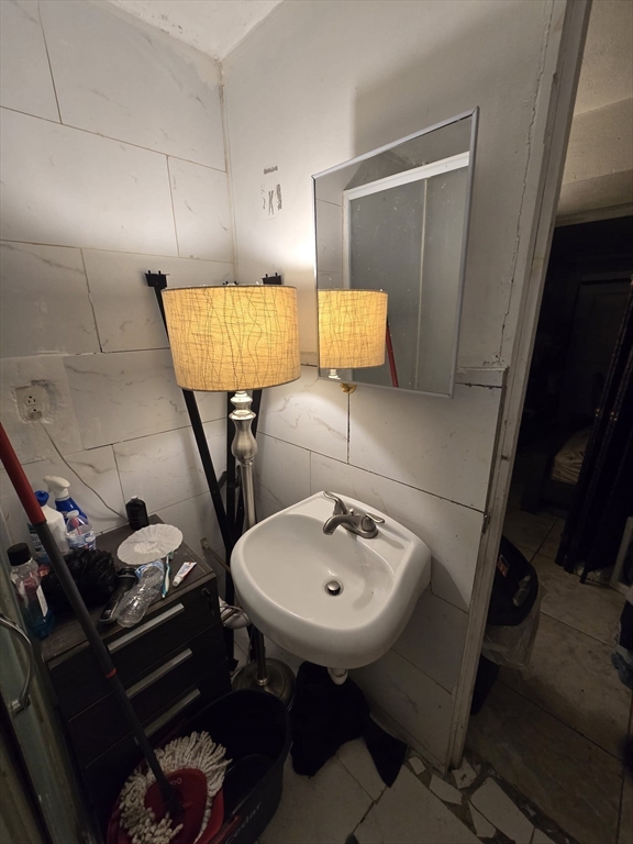 42 Raldne Road, Unit 1 Boston, MA 02136 - Photo 33 of 37 a bathroom with a sink and a mirror