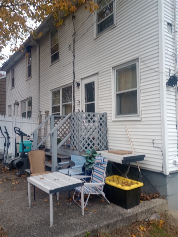 42 Raldne Road, Unit 1 Boston, MA 02136 - Photo 34 of 37 a view of a patio with a table and chairs and a fire pit