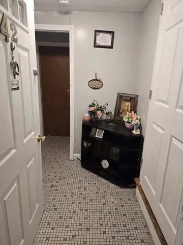 a room with a baby crib and a dresser