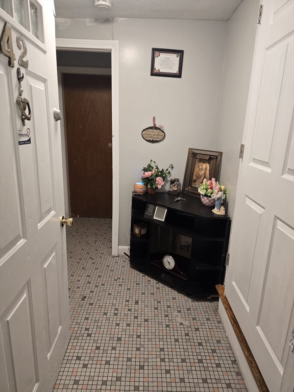 42 Raldne Road, Unit 1 Boston, MA 02136 - Photo 4 of 37 a room with a baby crib and a dresser