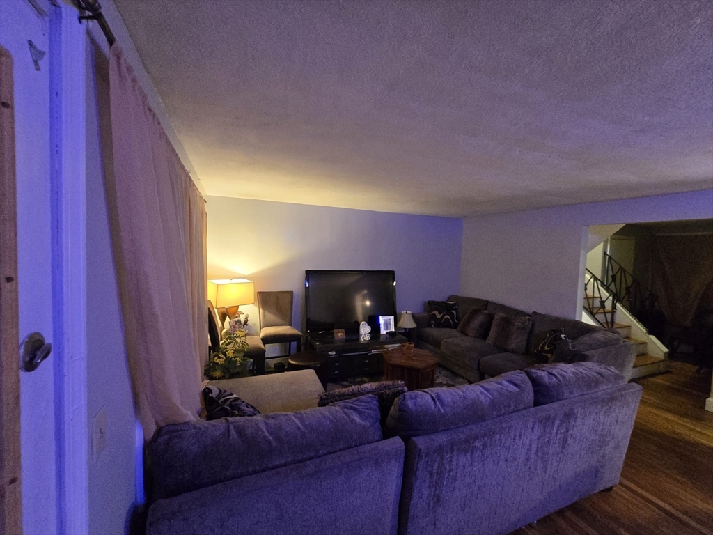 42 Raldne Road, Unit 1 Boston, MA 02136 - Photo 8 of 37 a living room with furniture and a fireplace