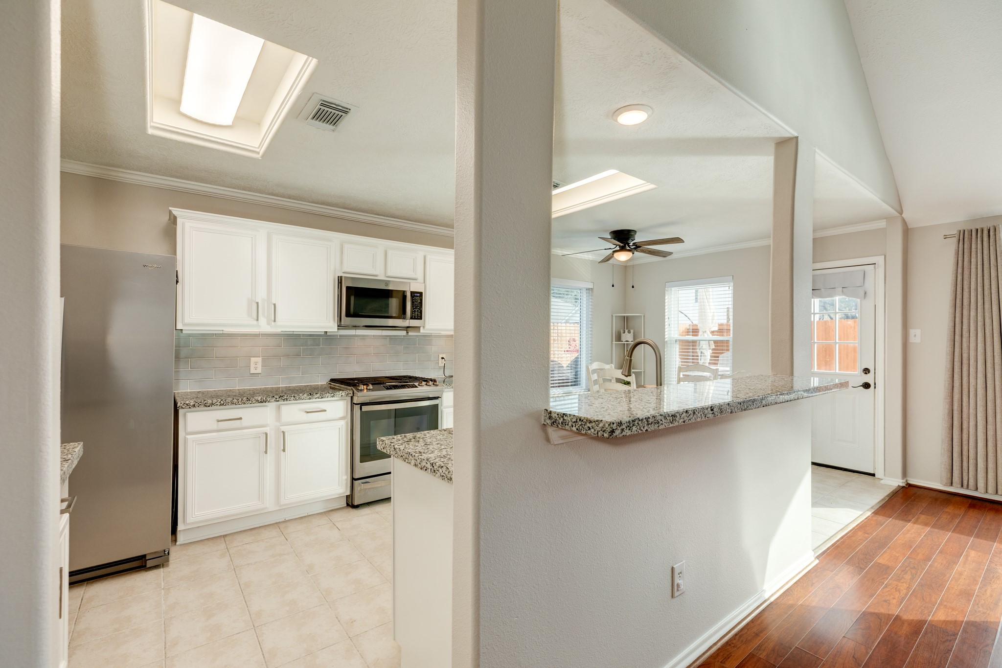 4113 Merlet Drive Pearland, TX 77584 - Photo 14 of 36 Another view of the kitchen from the family room.