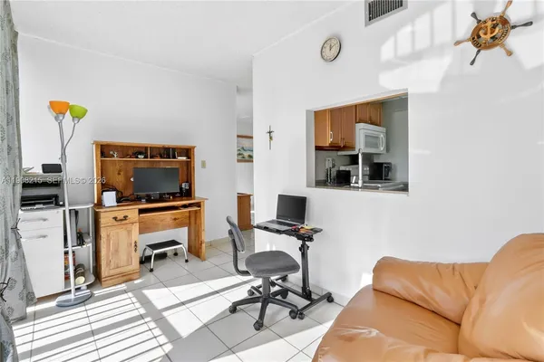 a workspace with furniture and gym equipment