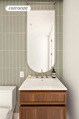 a bathroom with a toilet a sink and bathtub