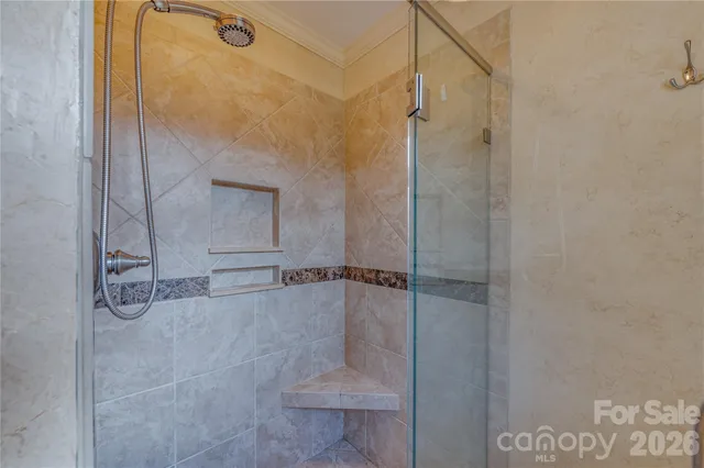 a bathroom with a granite countertop sink mirror and a bath tub