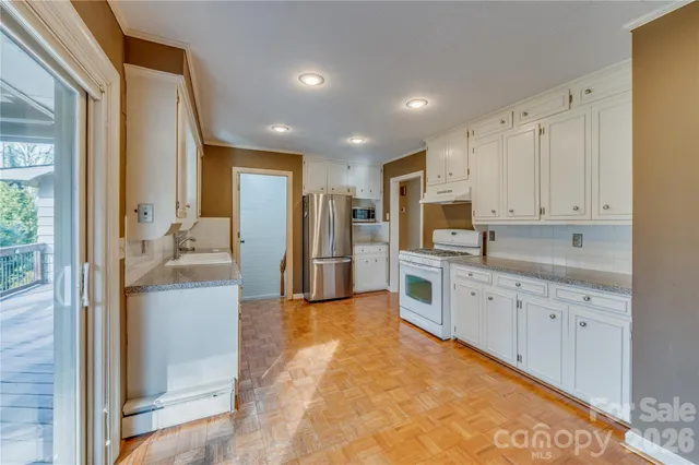 a large kitchen with cabinets