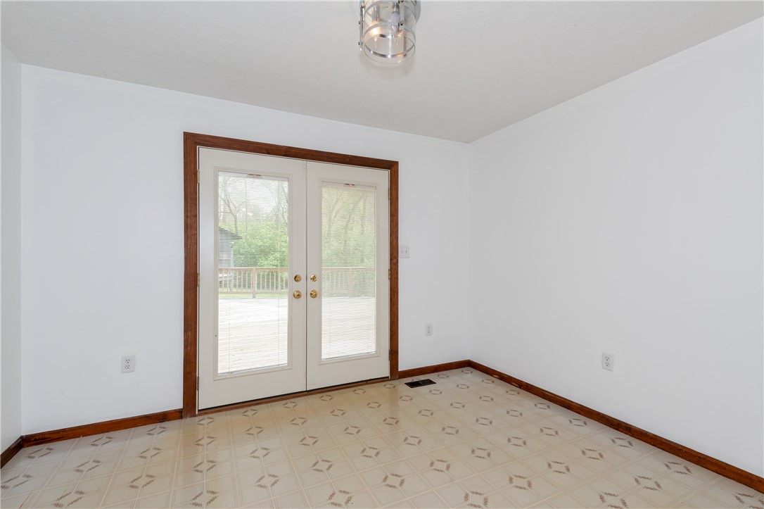 6750 Little Twin Road Germantown, OH 45327 - Photo 14 of 88 This bright room features durable flooring and French doors opening to an outdoor deck.