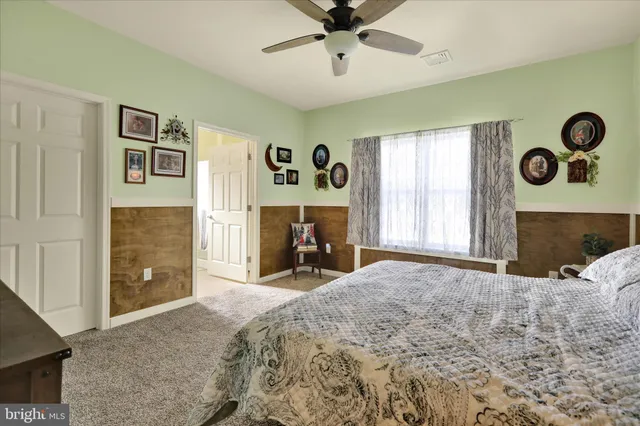 a bedroom with a bed and a fireplace