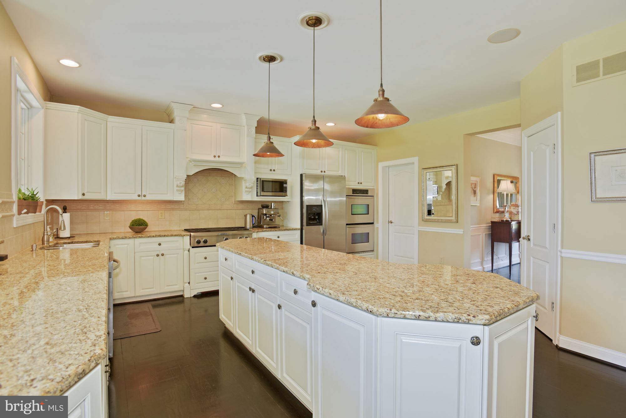 74 Balsam Road Lumberton, NJ 08048 - Photo 16 of 56 a kitchen with stainless steel appliances granite countertop a stove a sink a center island a microwave and cabinets