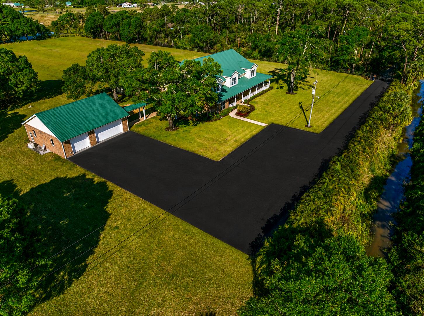 8686 Andrews Avenue Fort Pierce, FL 34945 - Photo 71 of 76 an aerial view of a house with a garden