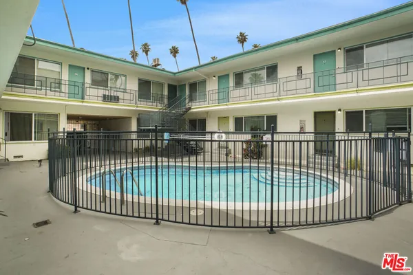 an aerial view of a house with swimming pool