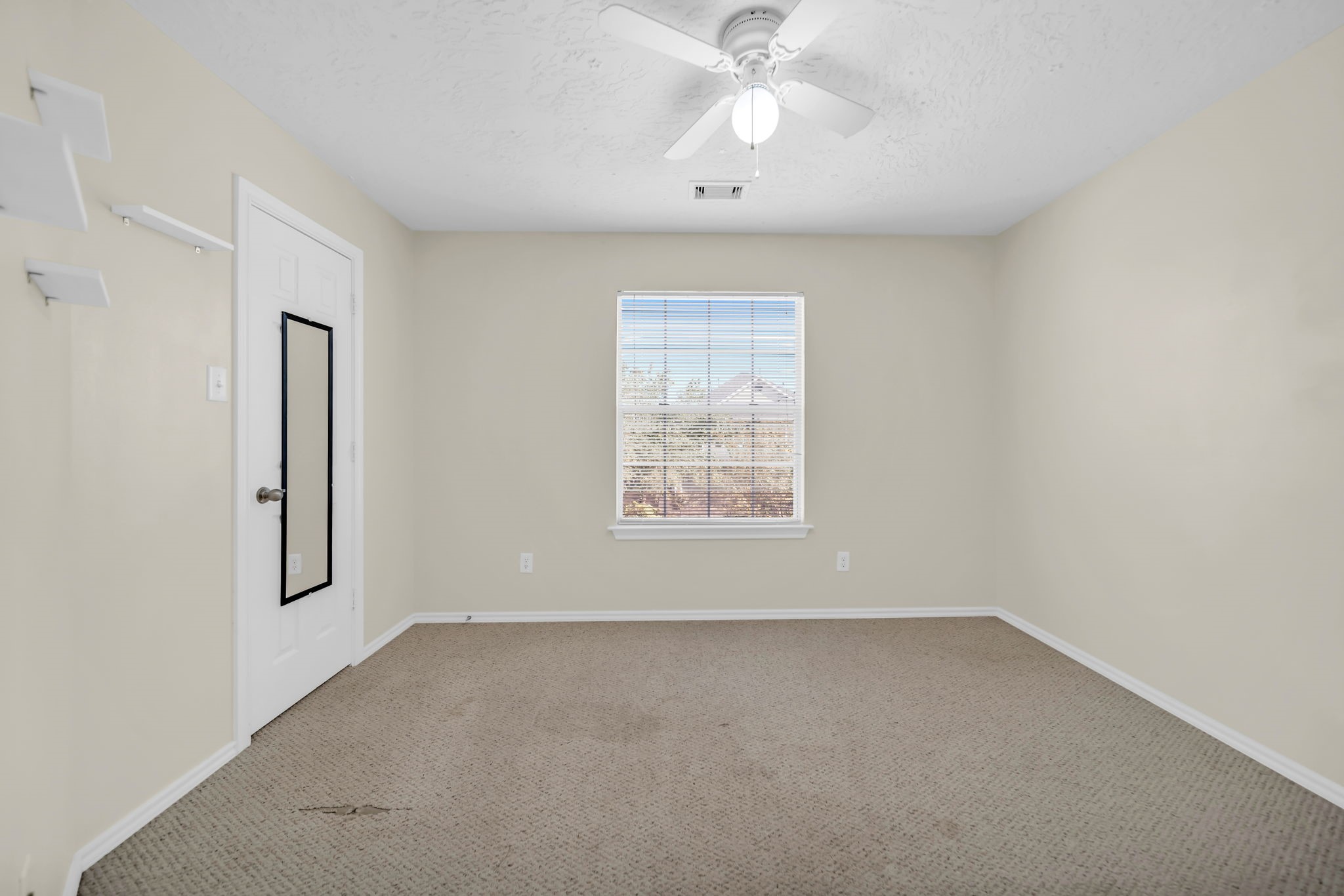 8918 Elm Drake Lane Humble, TX 77338 - Photo 12 of 20 an empty room with a window