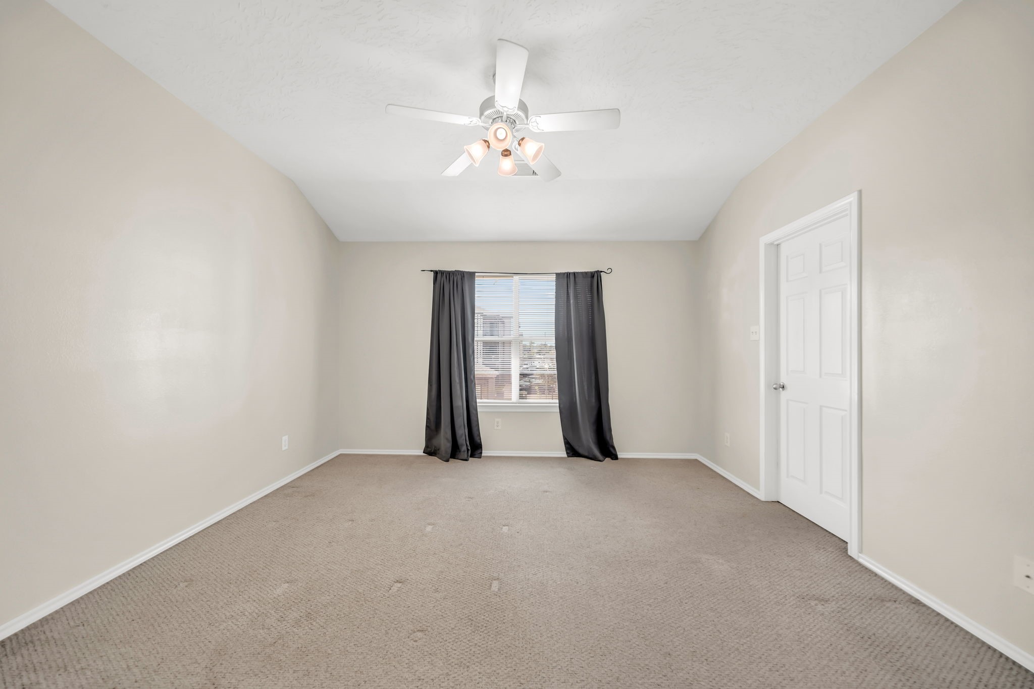 8918 Elm Drake Lane Humble, TX 77338 - Photo 15 of 20 a view of an empty room with a window