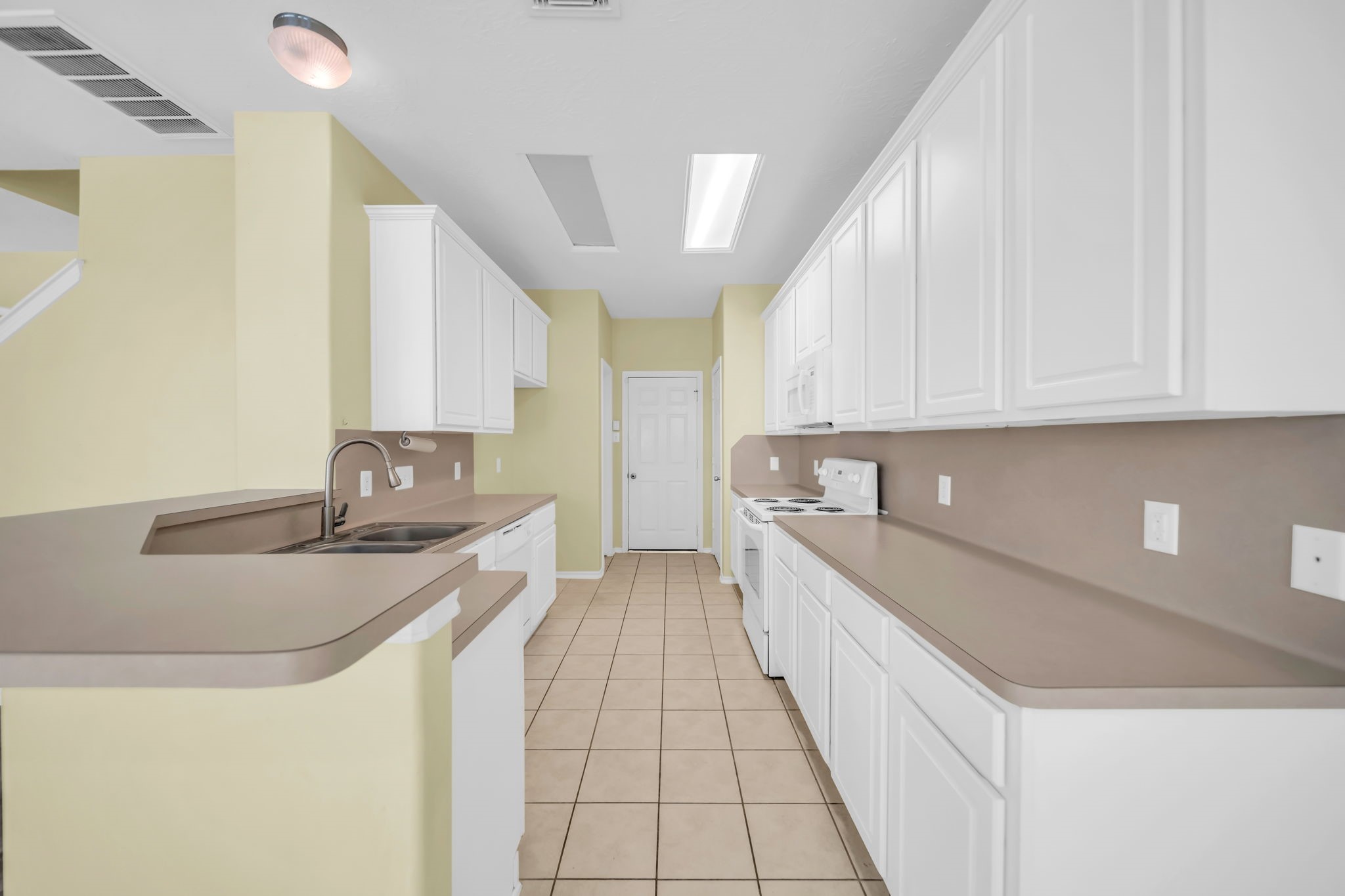 8918 Elm Drake Lane Humble, TX 77338 - Photo 6 of 20 a kitchen with a sink and cabinets