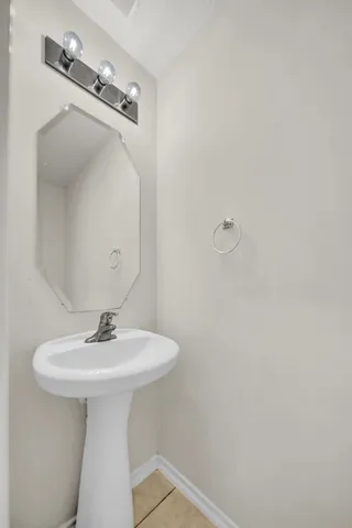 a bathroom with a sink and mirror