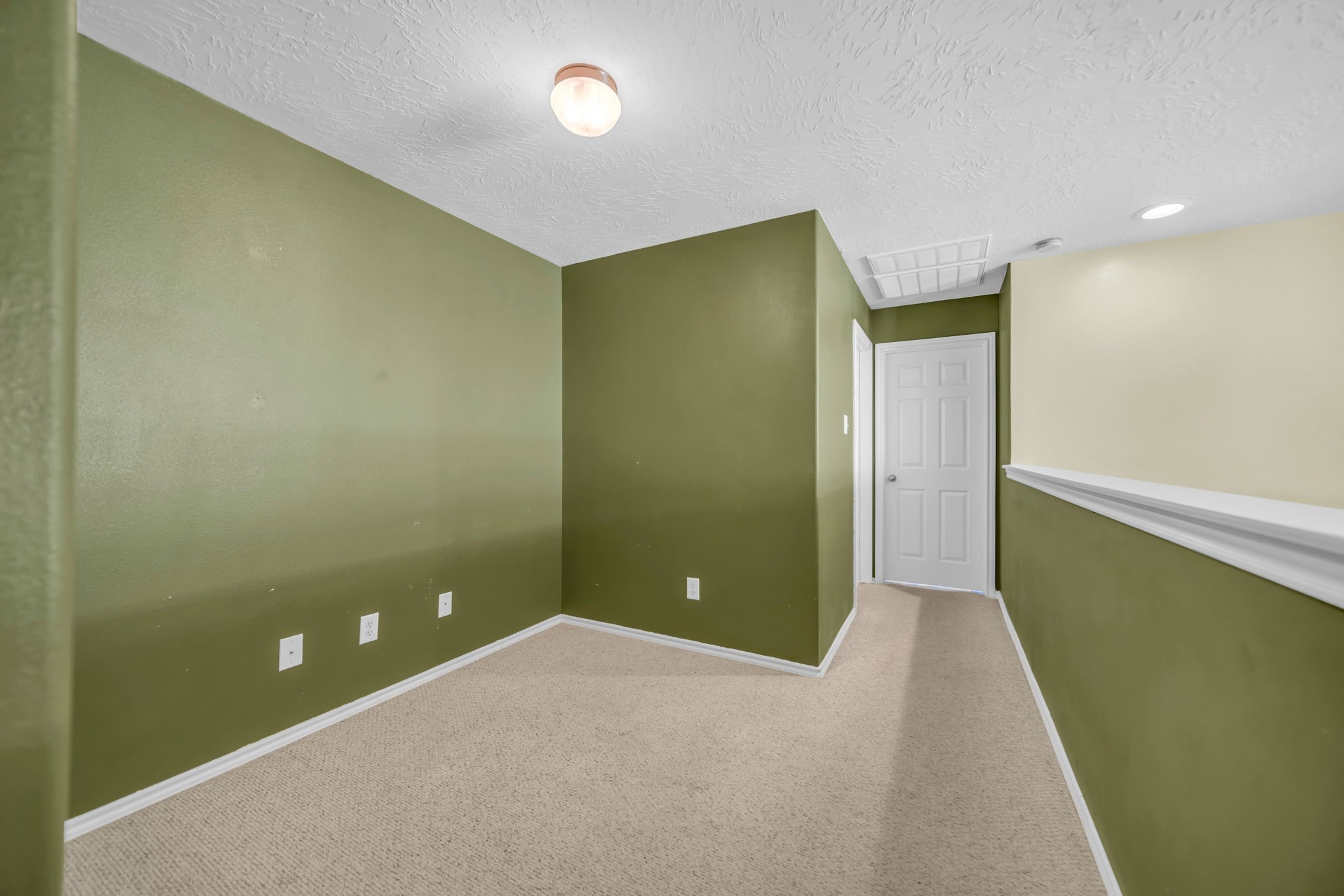 8918 Elm Drake Lane Humble, TX 77338 - Photo 9 of 20 a view of an empty room with wooden floor