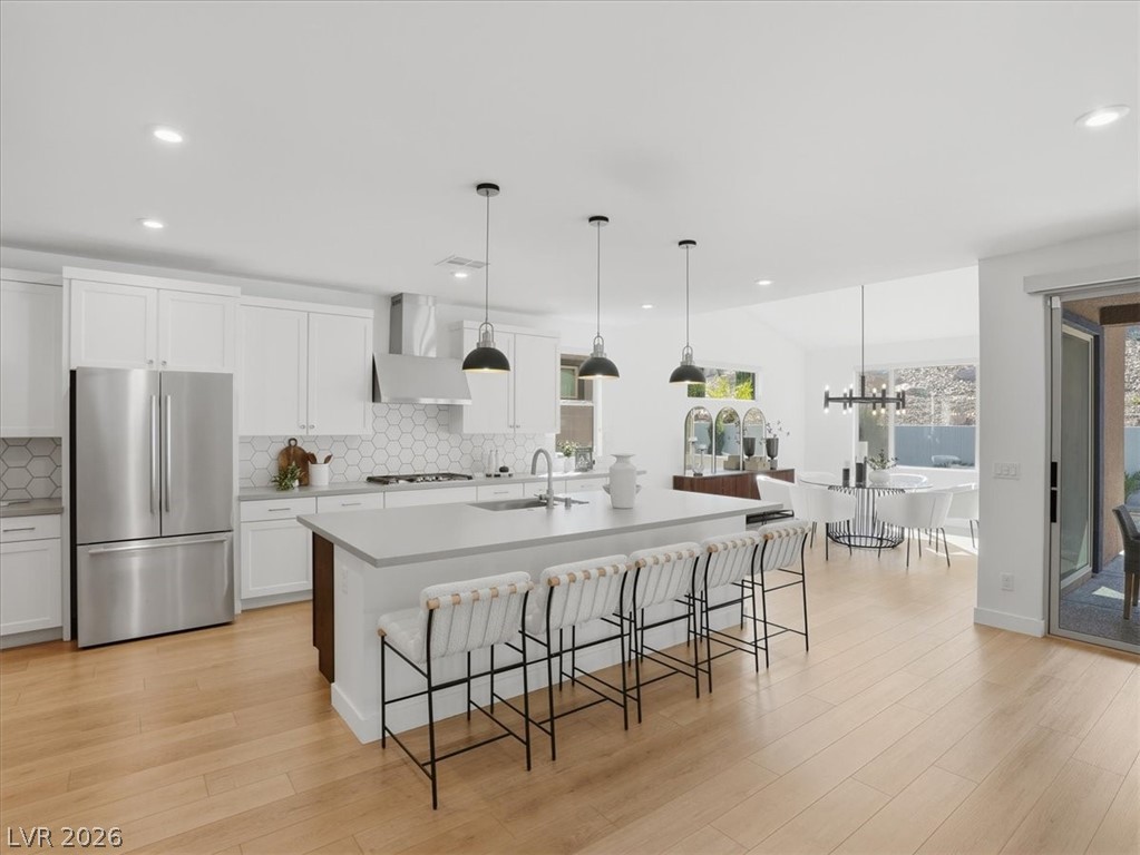 9725 Starlight Ridge Avenue Las Vegas, NV 89148 - Photo 8 of 47 This kitchen features sleek countertops, modern appliances, and a spacious island, perfect for entertaining.