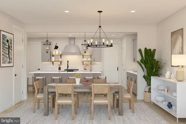 a view of a dining room with furniture wooden floor and chandelier