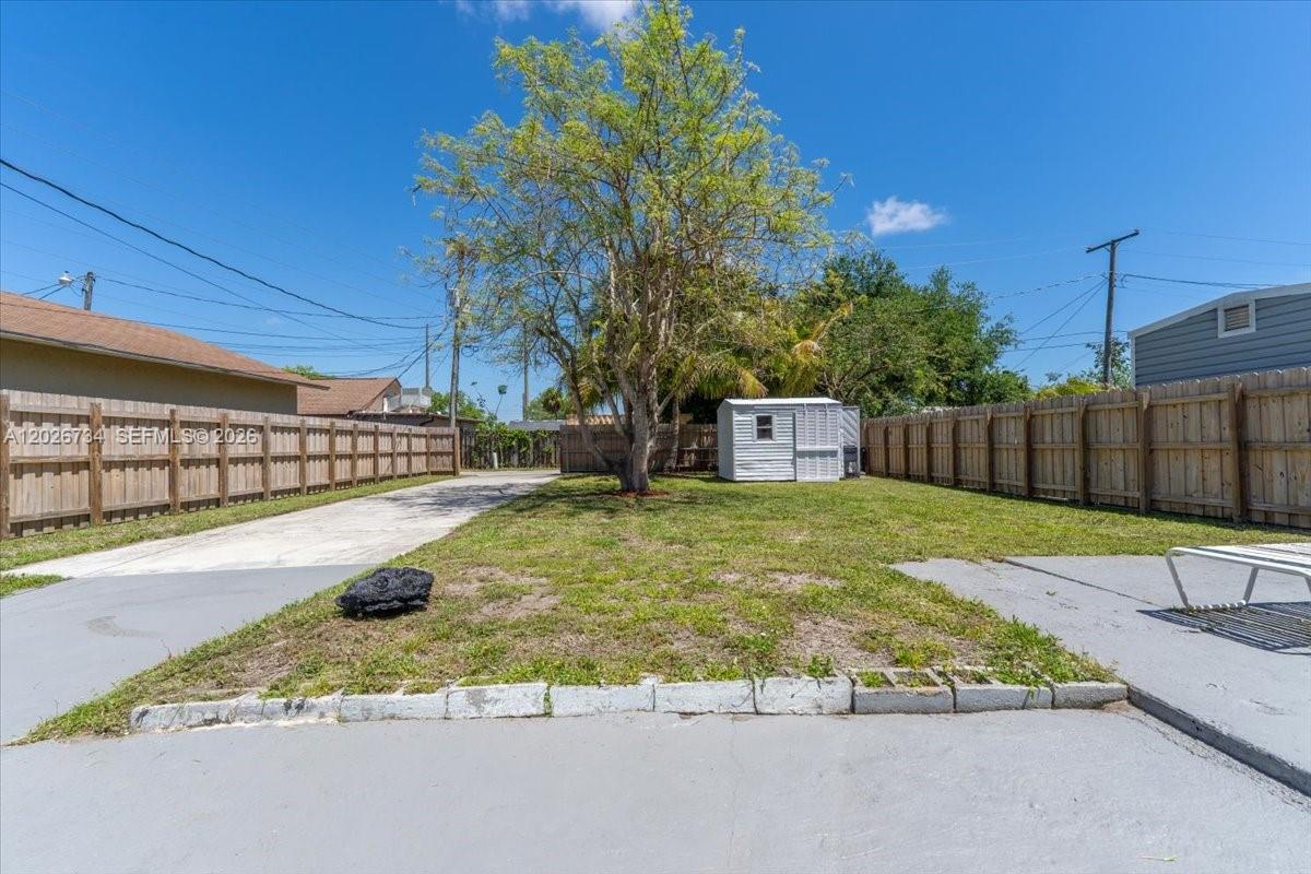 266 Southwest 6th Street Dania Beach, FL 33004 - Photo 27 of 37 a view of backyard with swimming pool and sitting area