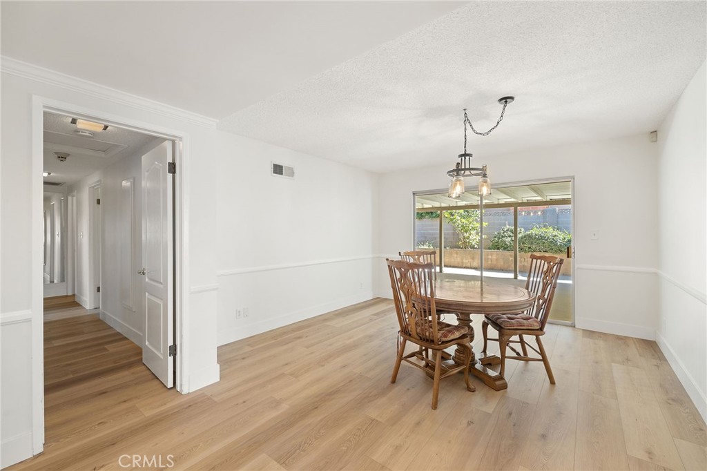 1176 Steele Drive Brea, CA 92821 - Photo 13 of 39 a view of a dining room with furniture window and wooden floor
