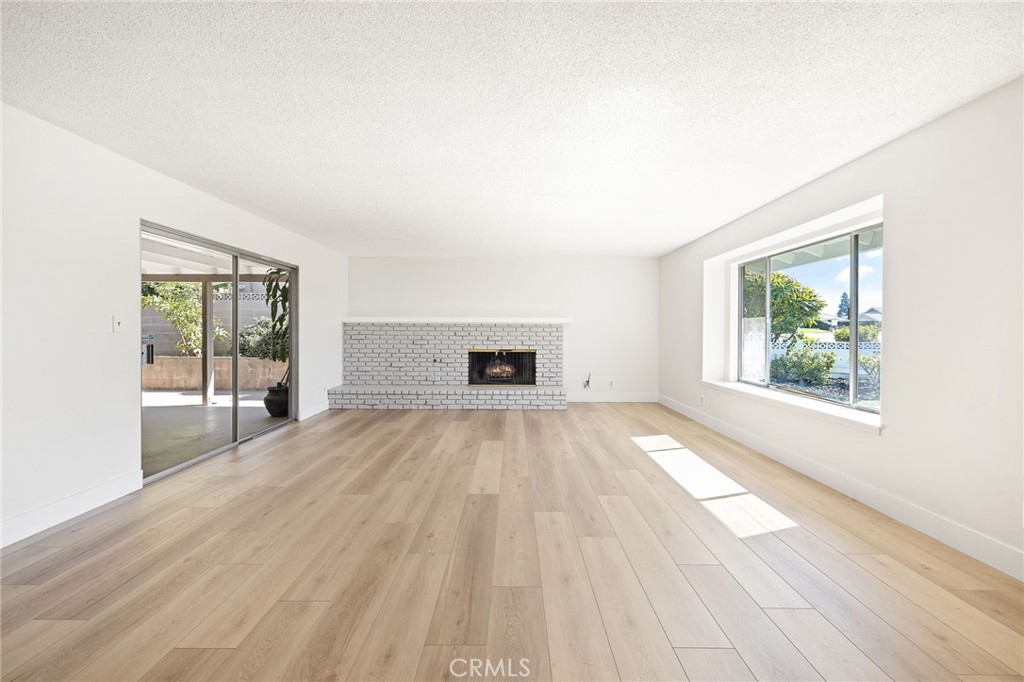 1176 Steele Drive Brea, CA 92821 - Photo 4 of 39 a view of empty room with wooden floor and fan