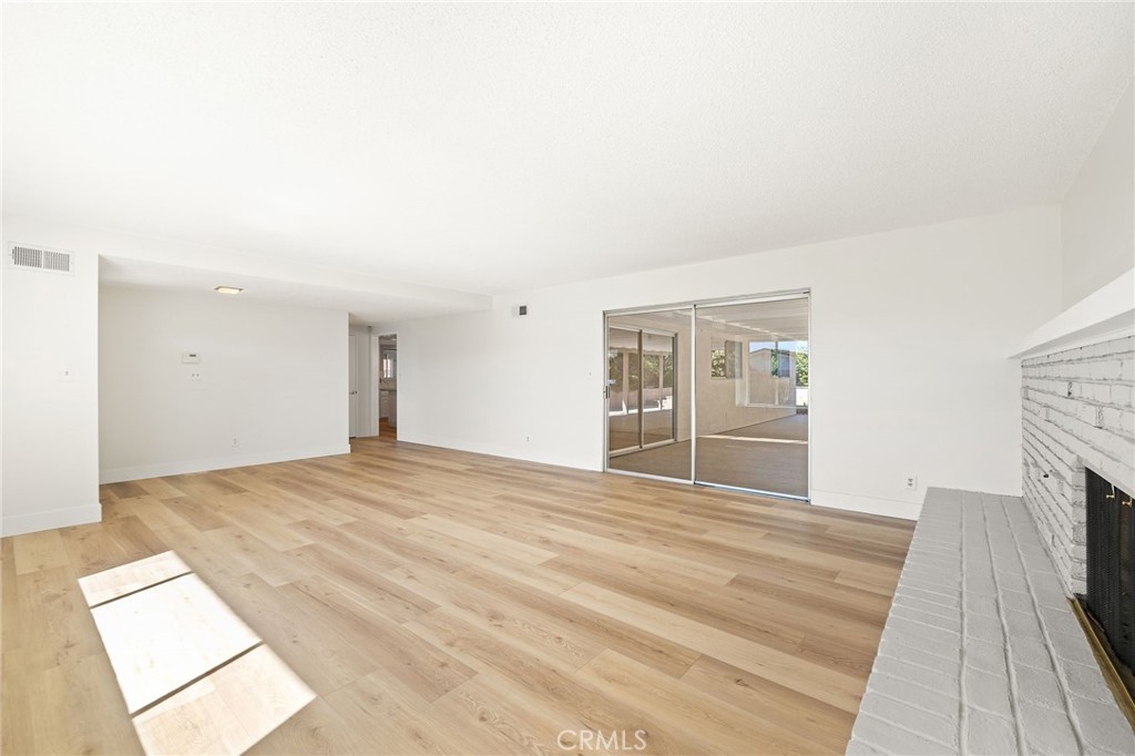 1176 Steele Drive Brea, CA 92821 - Photo 6 of 39 a view of empty room with wooden floor