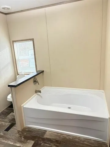 a bathroom with a bathtub and shower