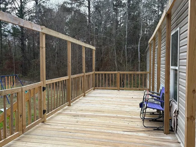 a view of balcony and wooden floor