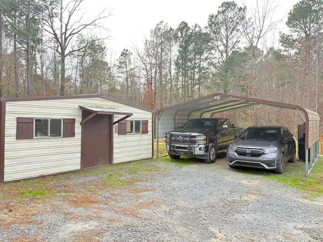 a view of a car in back of a house