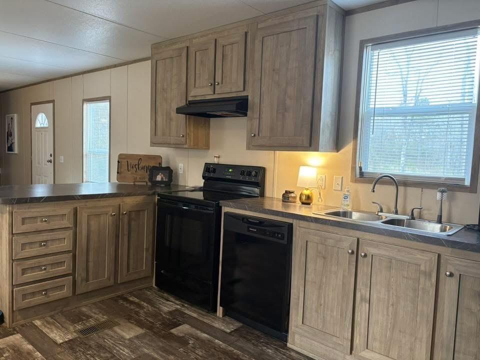 100 Shanee Drive Gloster, LA 71030 - Photo 3 of 19 a kitchen with granite countertop a sink cabinets stainless steel appliances and a window