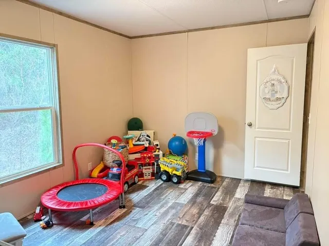 a room with toys and wooden floor